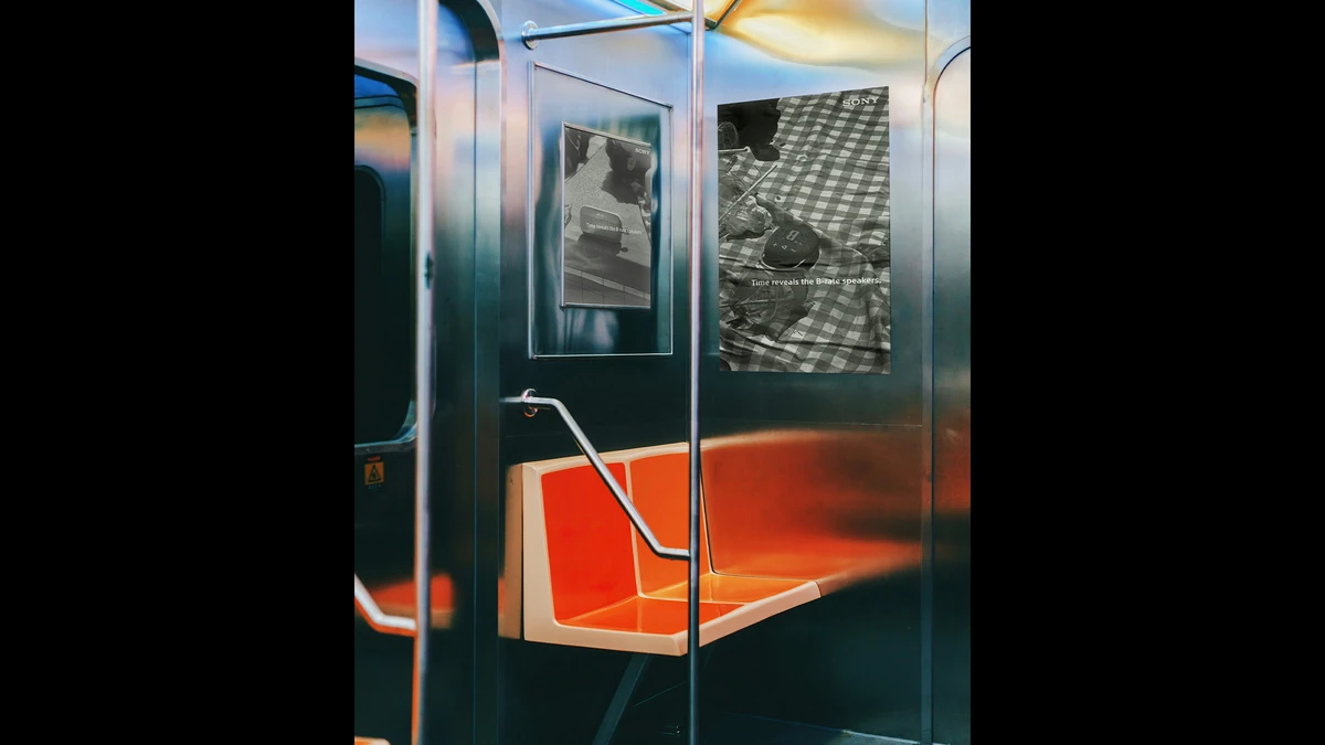 Poster placements inside a subway car, showing the poolside and picnic executions.